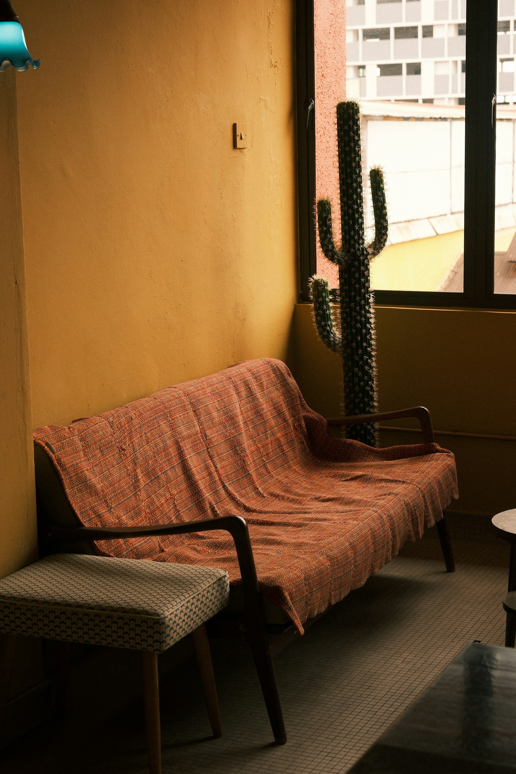 Warm urban lounge with natural textures and uncluttered styling
